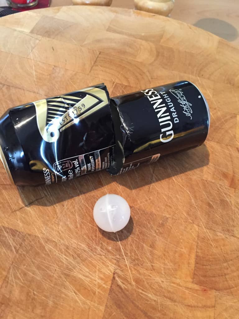 A cut open can of Guinness